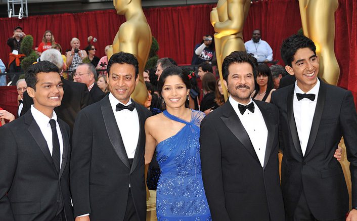 Dev Patel with the star cast of Slumdog Millionaire at Oscars