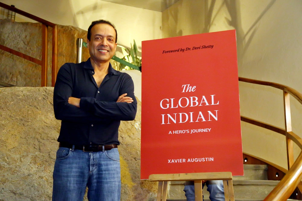 Xavier Augustin with his book