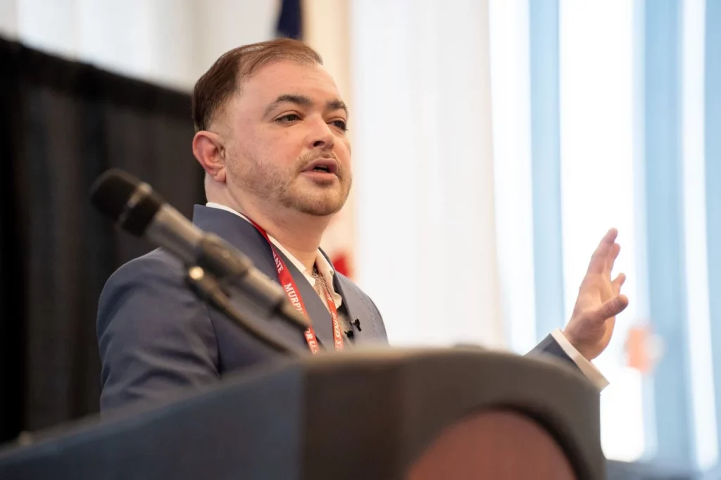 Subir Saha as the keynote speaker at an event at the Rider University